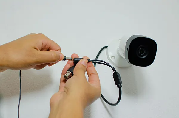 A CCTV camera with wired connectivity.