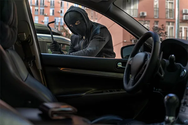 Someone trying to break into a car